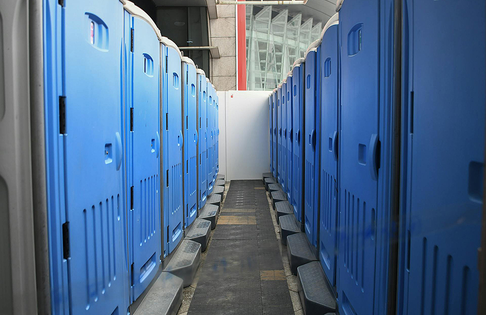 Two Rows Or Portable Toilets